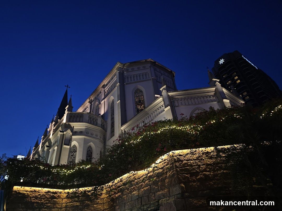 Church and Modern Building at Night