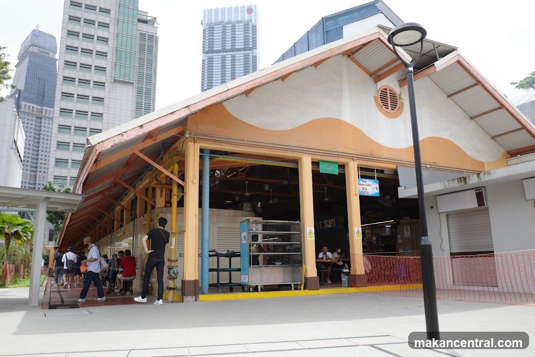 Outdoor Food Court with Modern Buildings in Background
