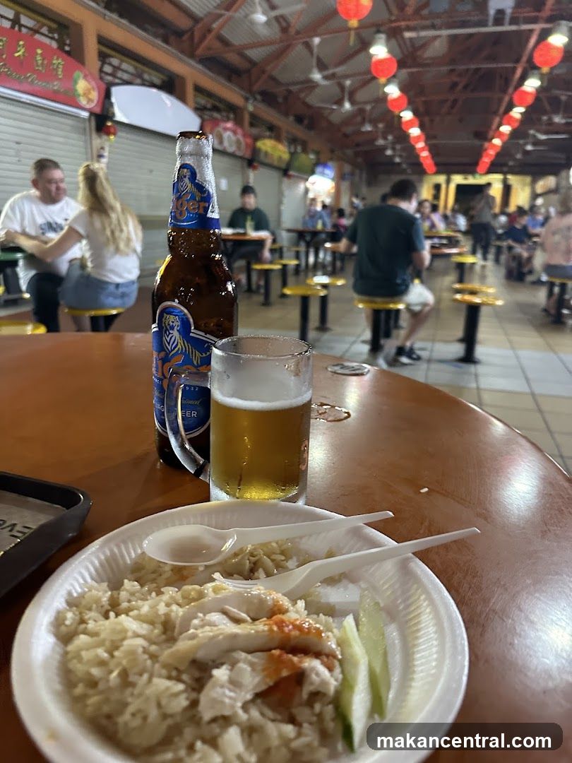 Hainanese Chicken Rice and Beer at a Food Court