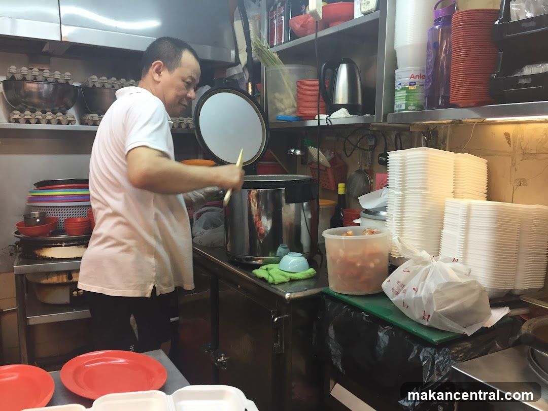 Cook preparing food in a kitchen