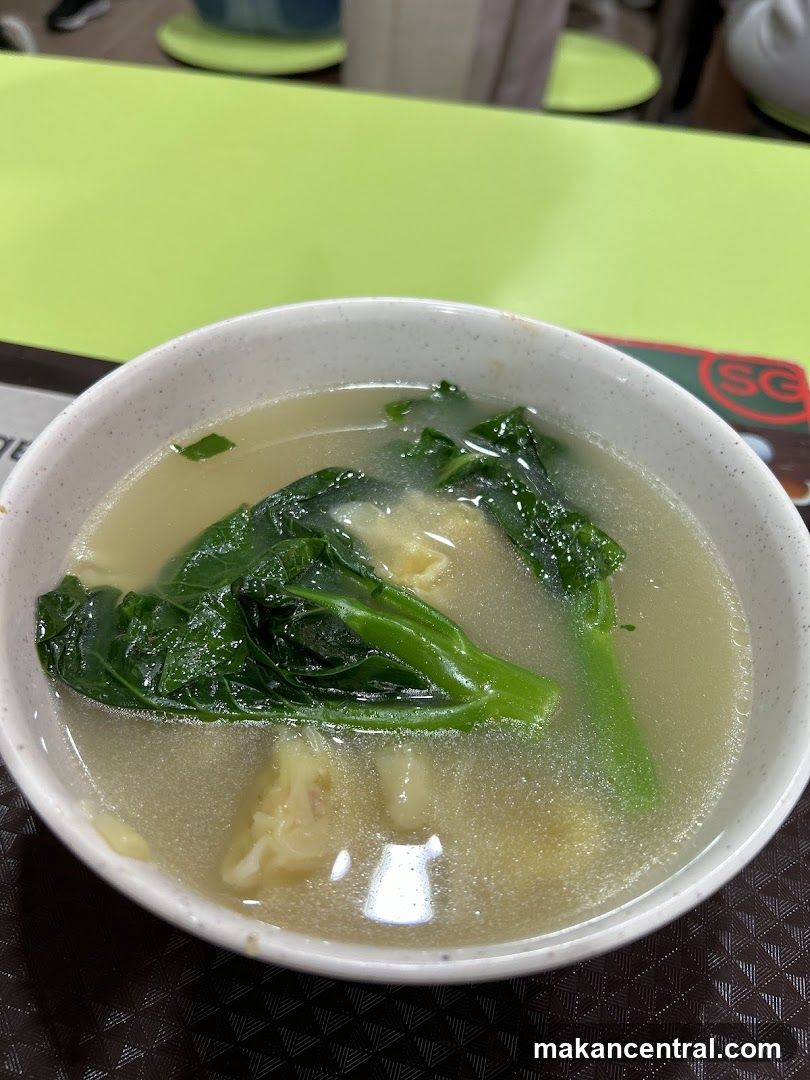 Bowl of Soup with Greens and Dumplings