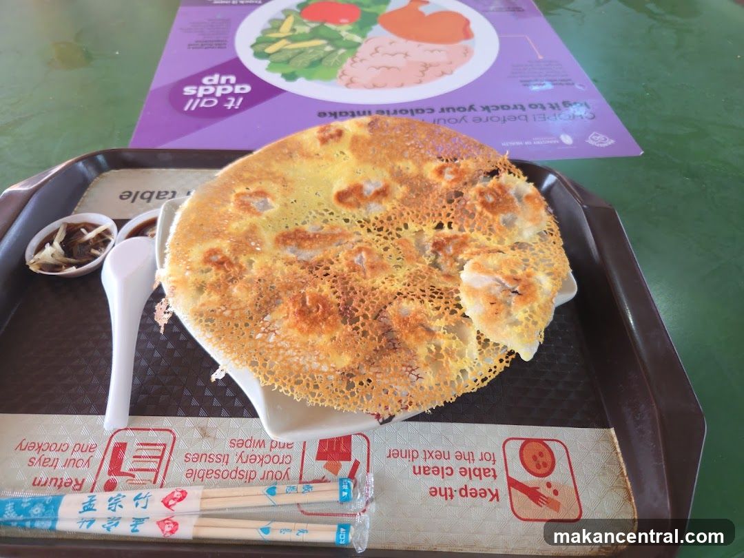 Pan-fried dumplings with dipping sauce