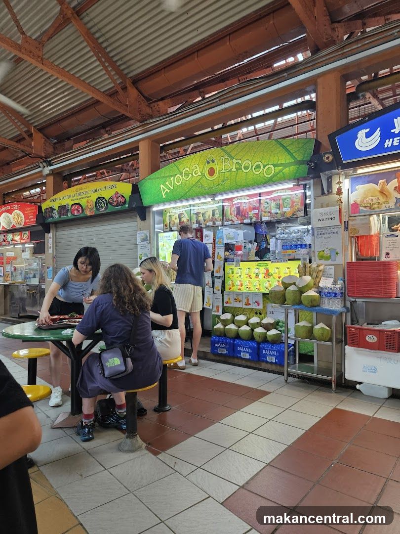 Food stall with avocado-themed signage