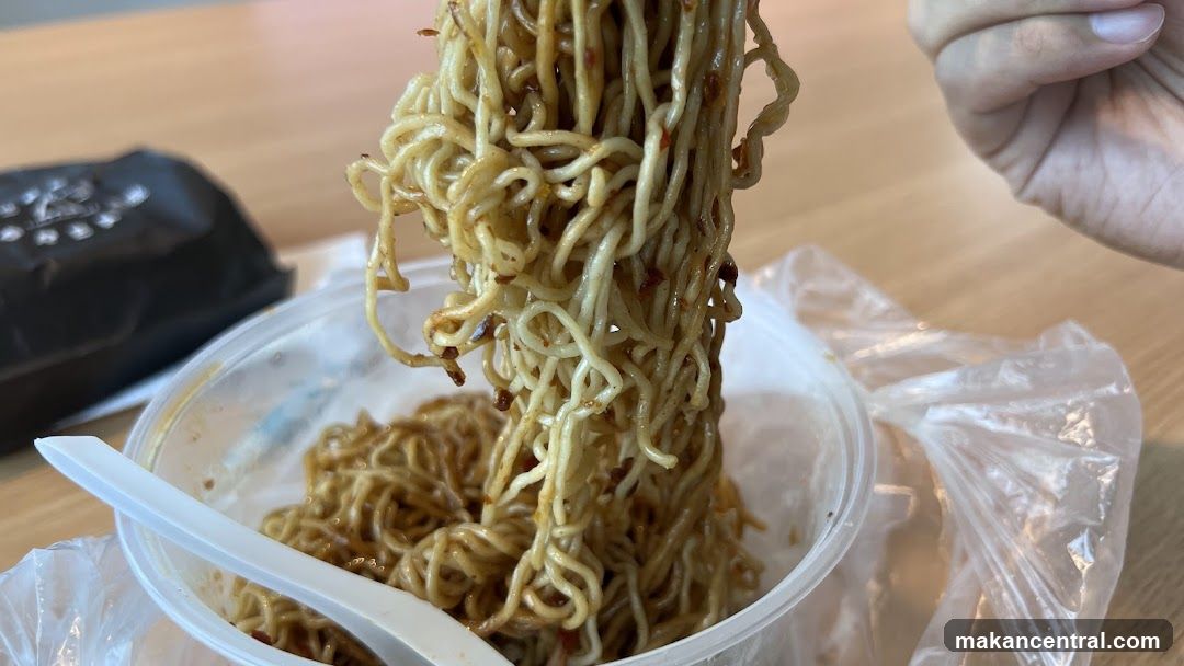 Noodles being lifted from a container