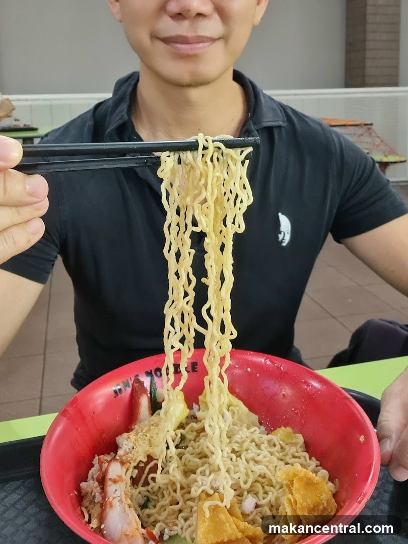 Person eating noodles