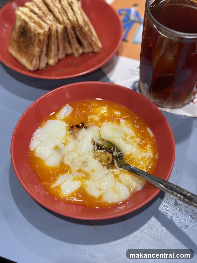 Soft-boiled eggs with toast and tea