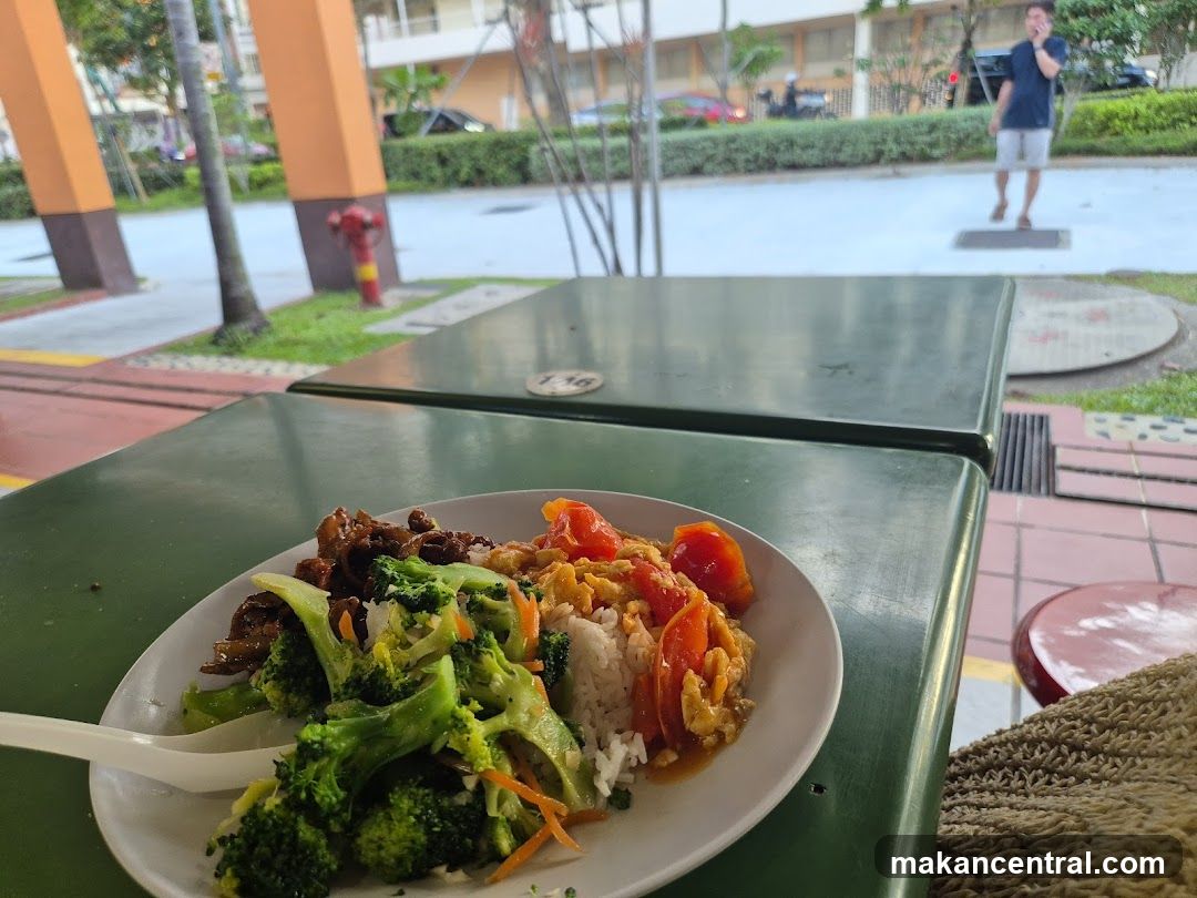 Food on a plate at an outdoor seating area
