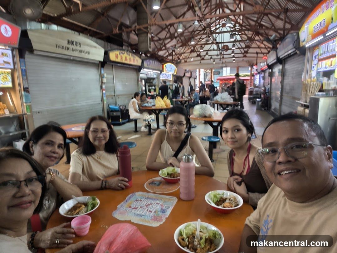 Family enjoying a meal at a food court