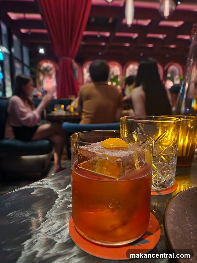 Cocktail on a table in a dimly lit bar