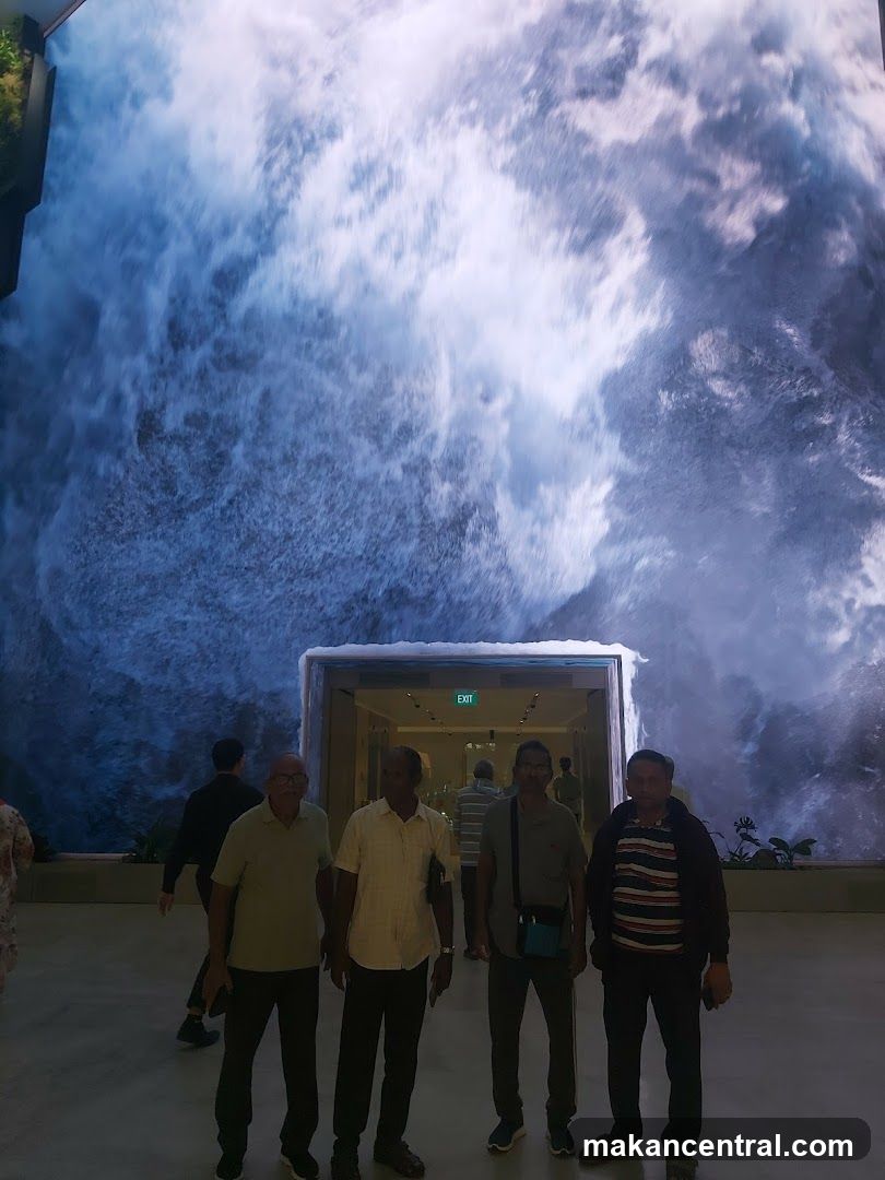 People in front of a large digital waterfall display