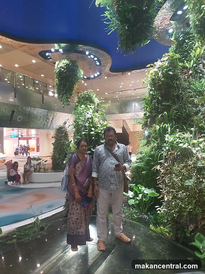 Couple Posing in a Lush Indoor Garden