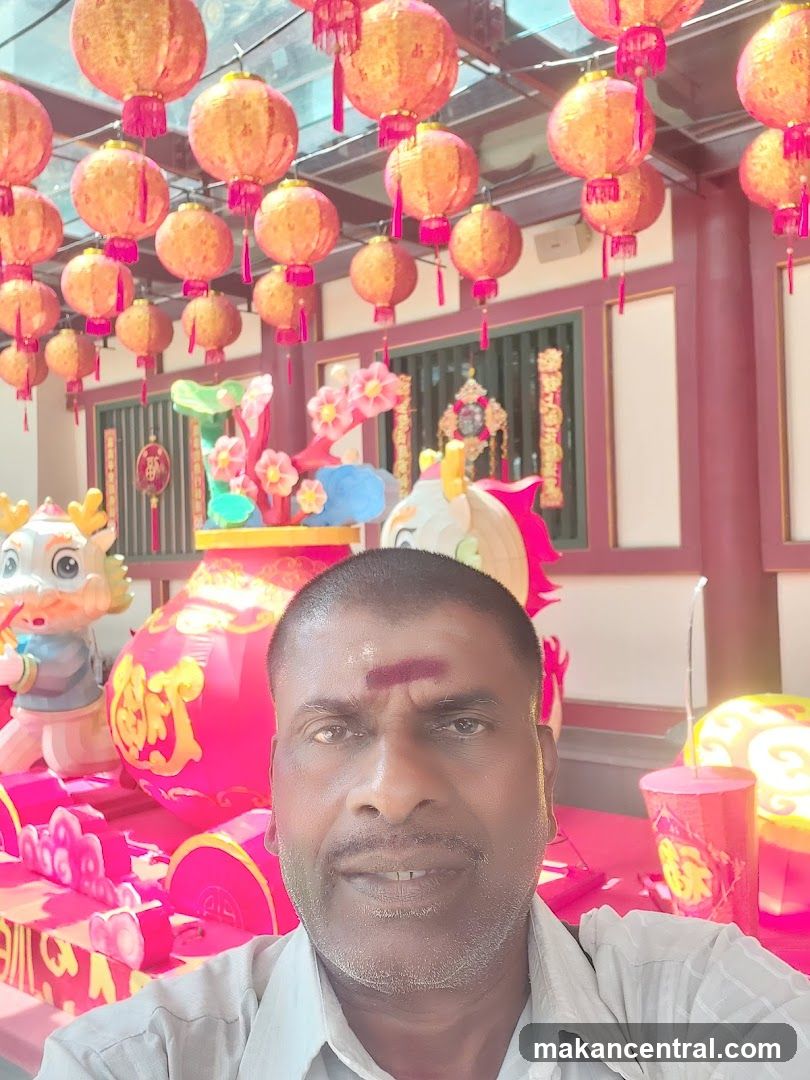 Man Posing with Festive Decorations