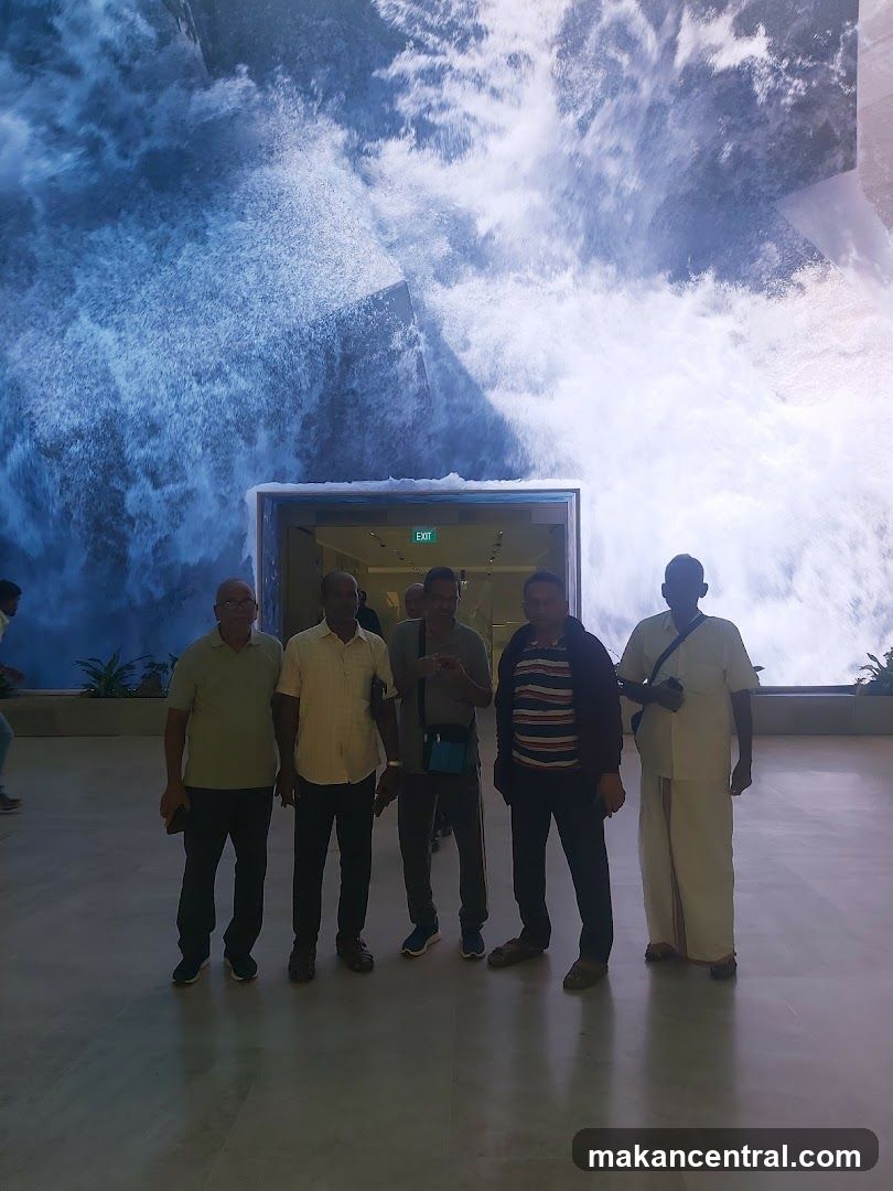 Group in front of waterfall display
