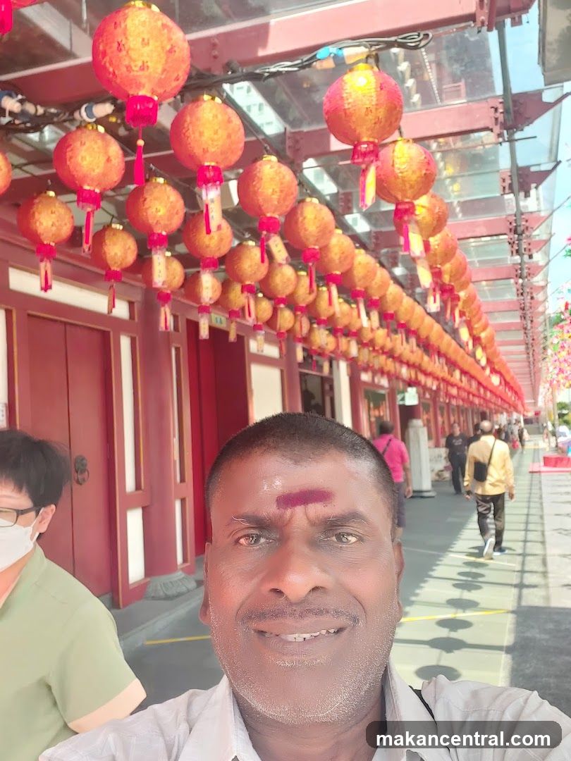 Man taking a selfie with red lanterns