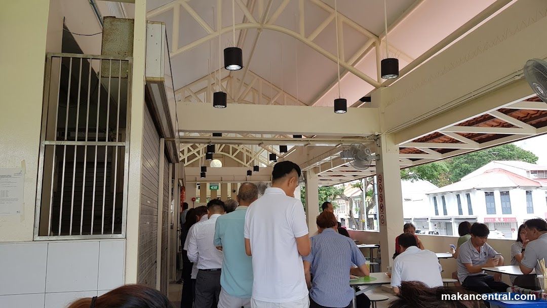 People queuing at an outdoor food court
