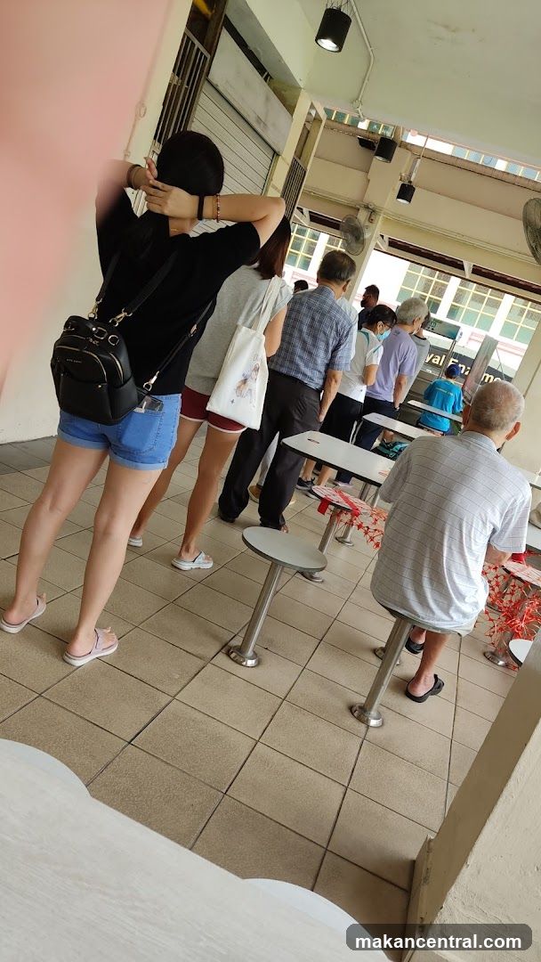 People in a food court queue