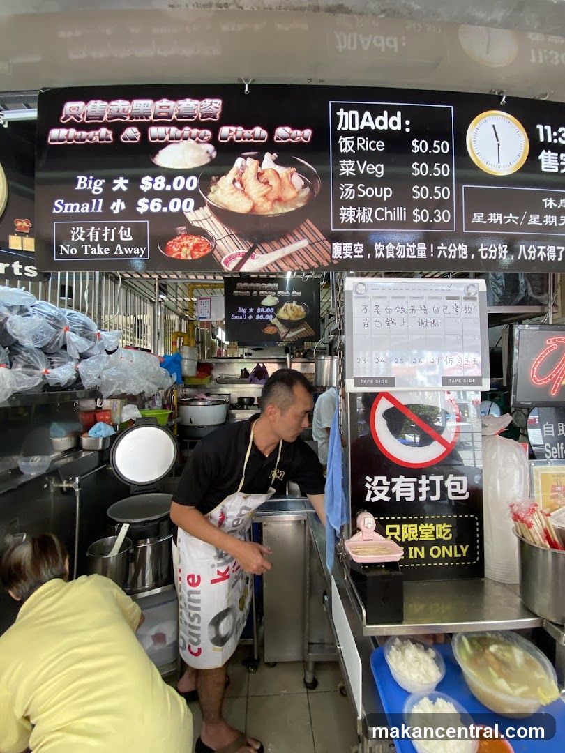 Food stall with menu and staff