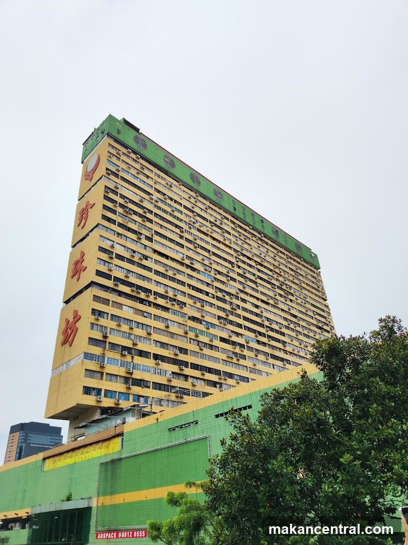 Tall Yellow Building with Green Trim