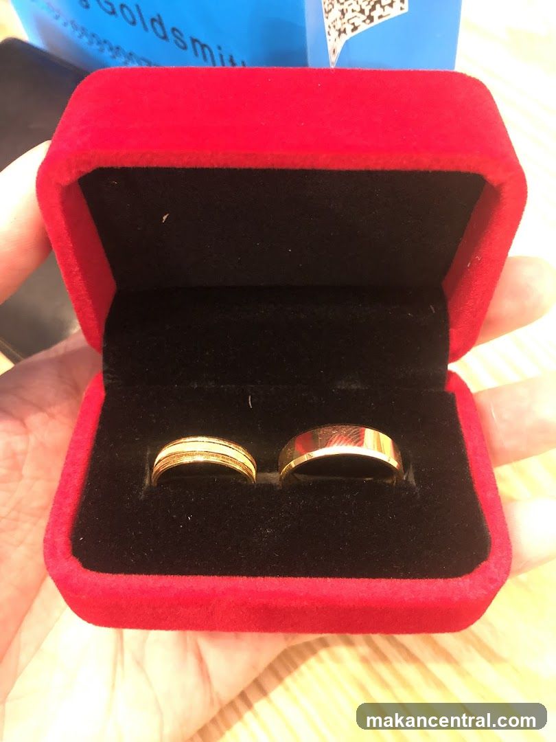 Two gold rings in a red velvet box