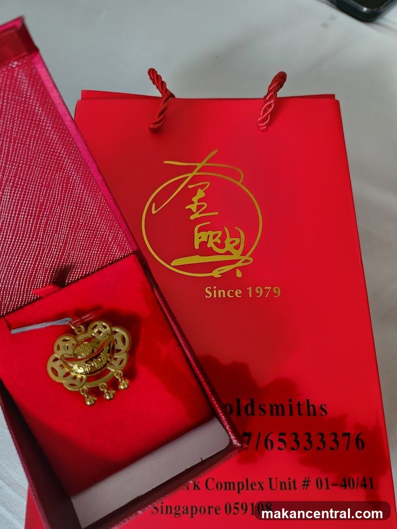 Gold Pendant and Shopping Bag
