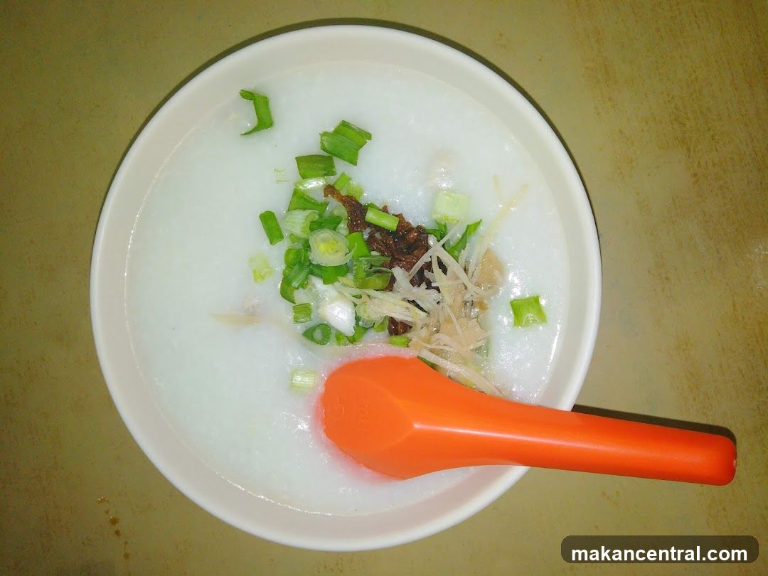 Congee with toppings and spoon