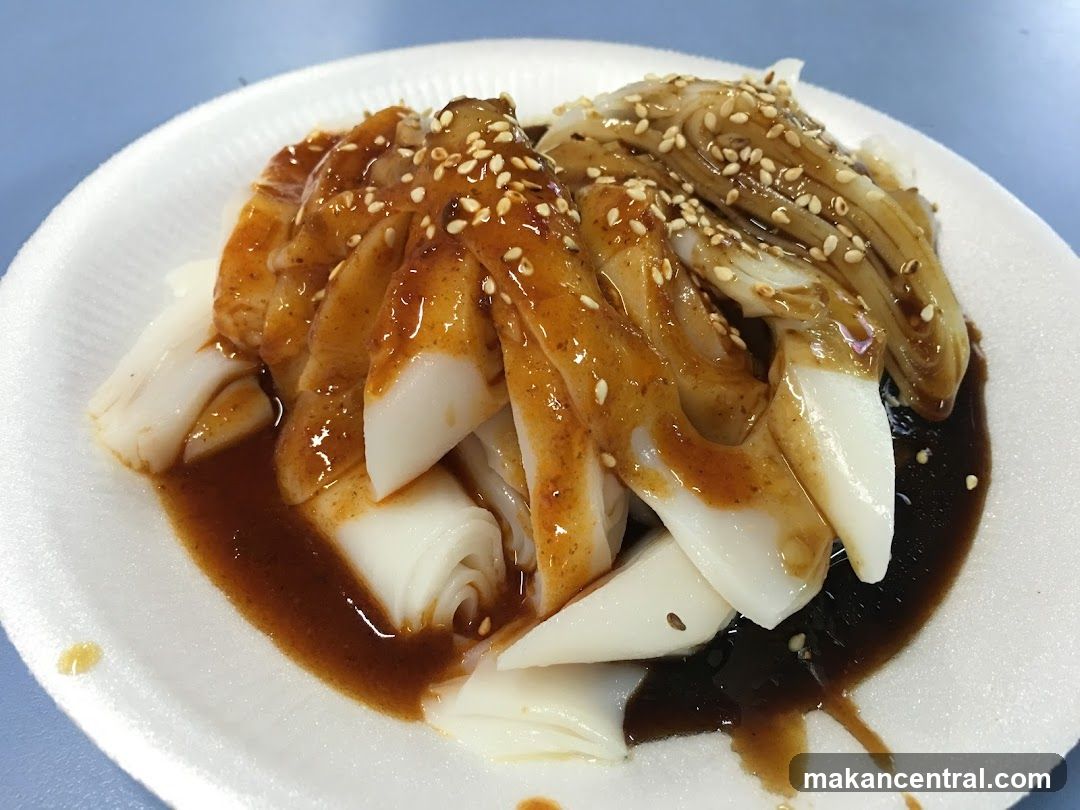 Chee Cheong Fun with Sauce and Sesame Seeds