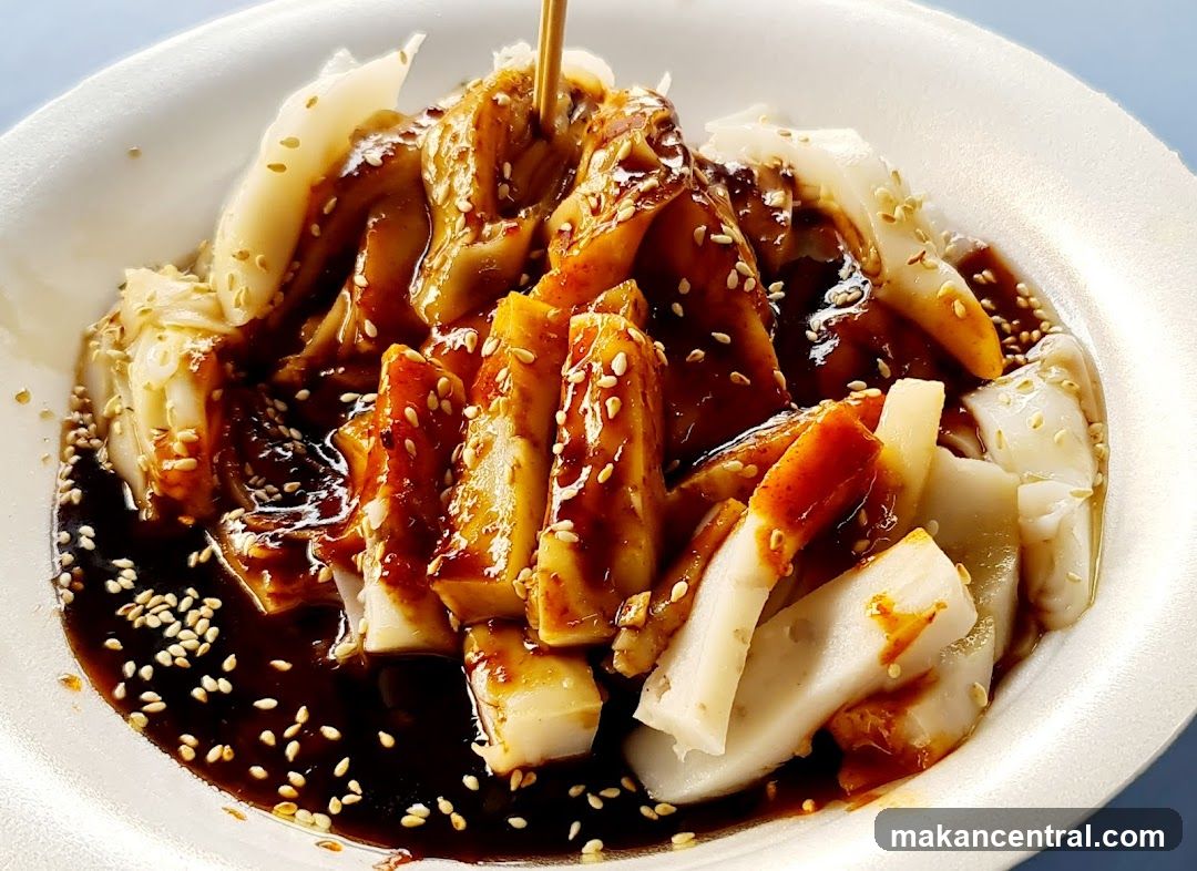 Chee Cheong Fun with Sauce and Sesame Seeds