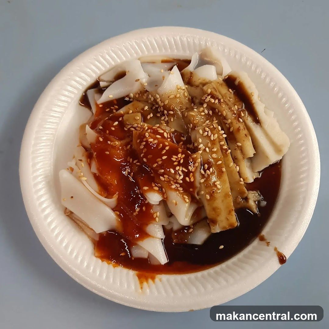 Steamed Rice Rolls with Sauce and Sesame Seeds