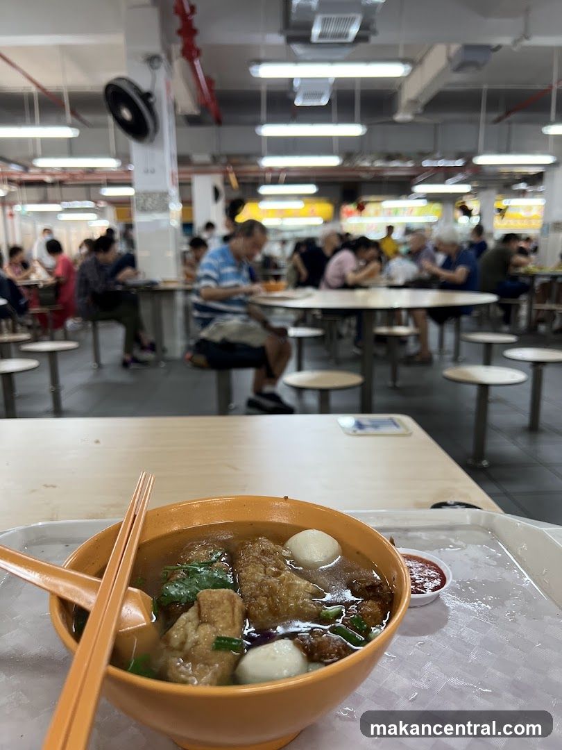 Food court scene with a bowl of noodles