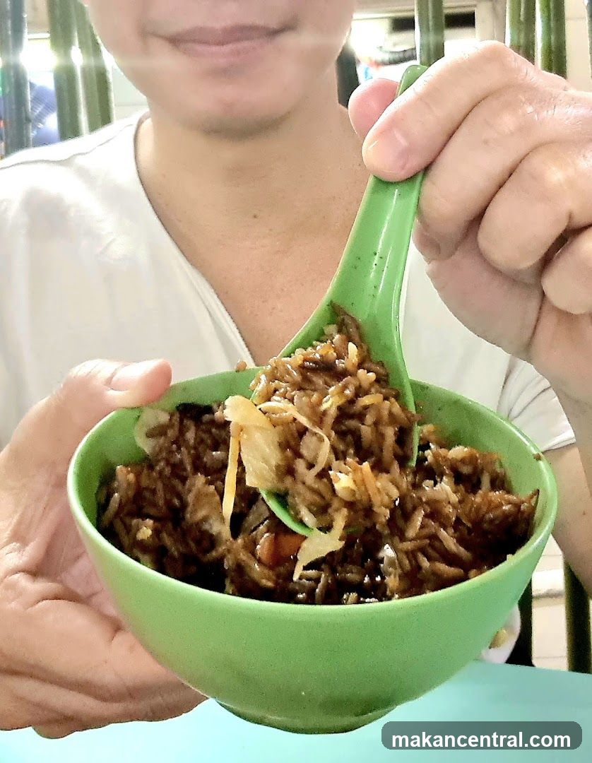 Person eating fried rice
