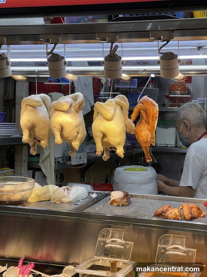 Hanging Chickens and Cooked Chicken Pieces