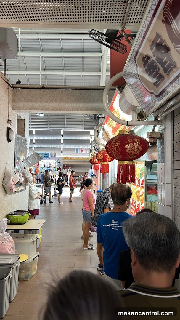People queuing at a food stall