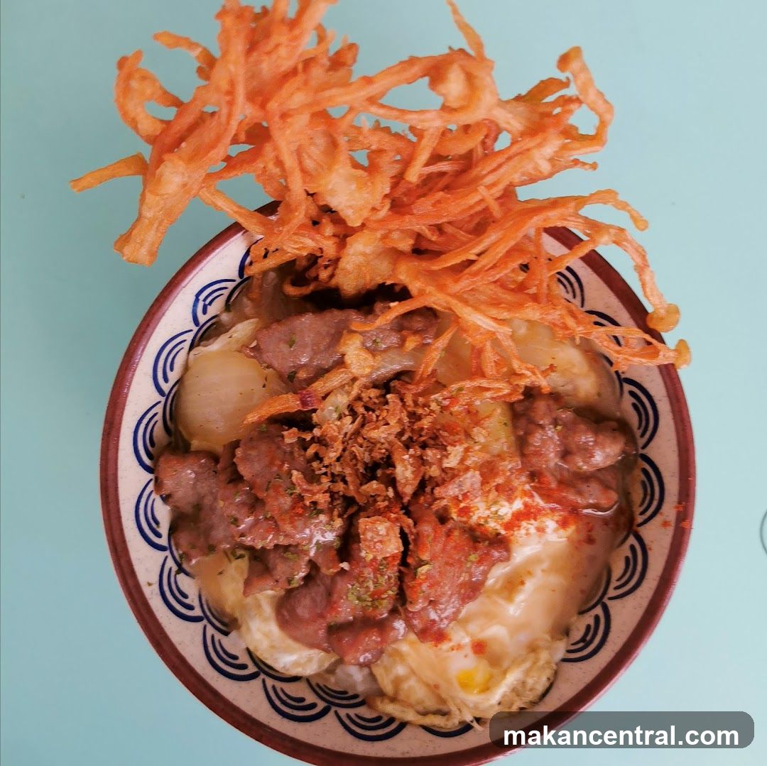 Bowl of food with fried enoki mushrooms