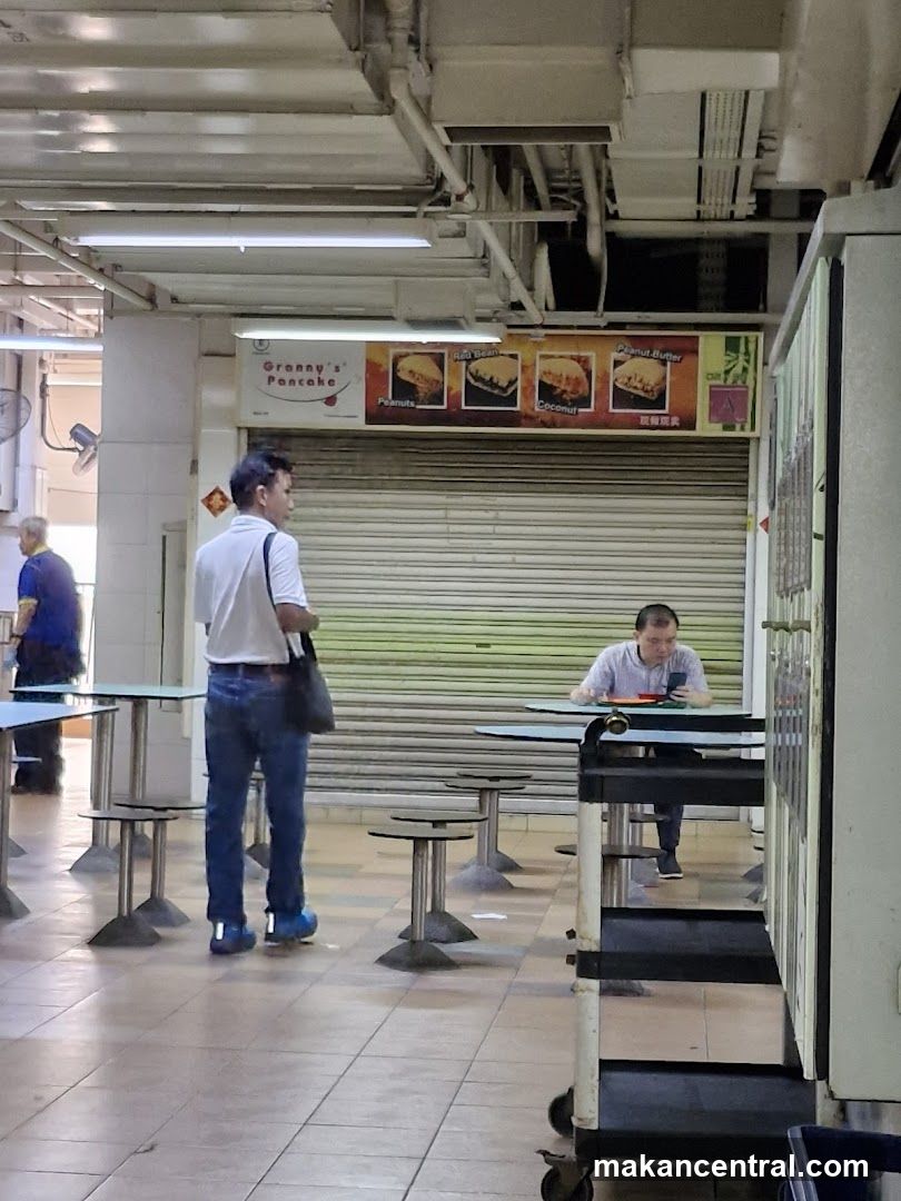 Food stall with pancake advertisements