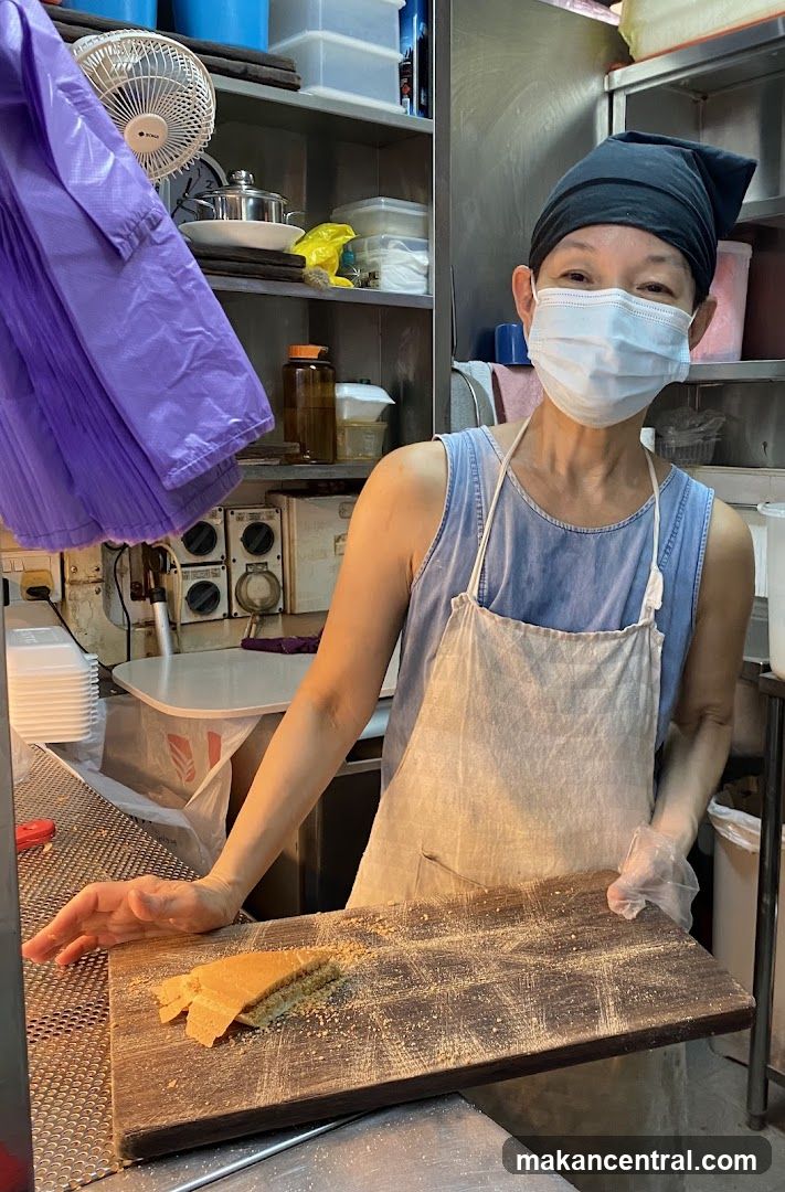 Food Vendor Preparing a Snack