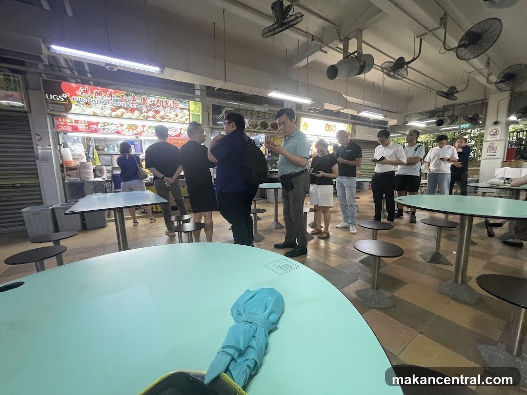 People queuing at a food stall