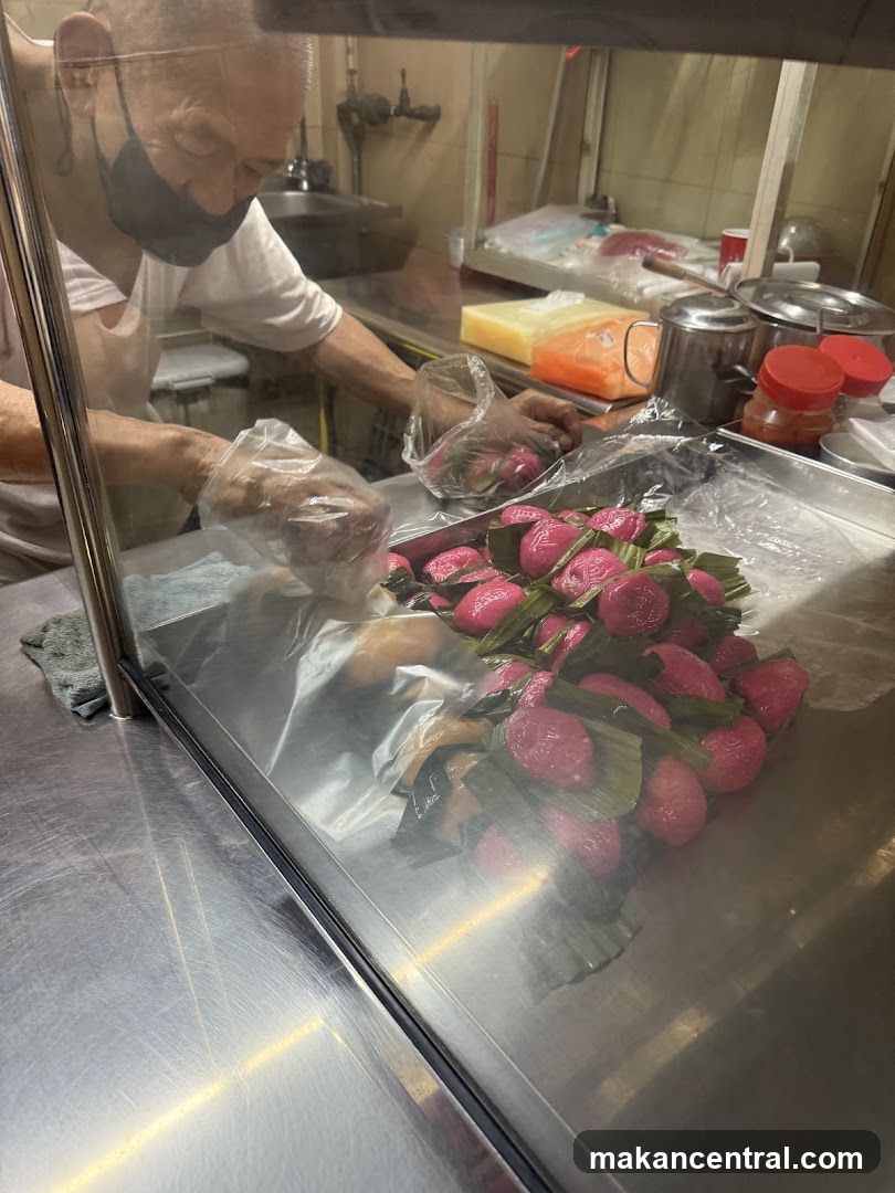 Baker preparing pink pastries