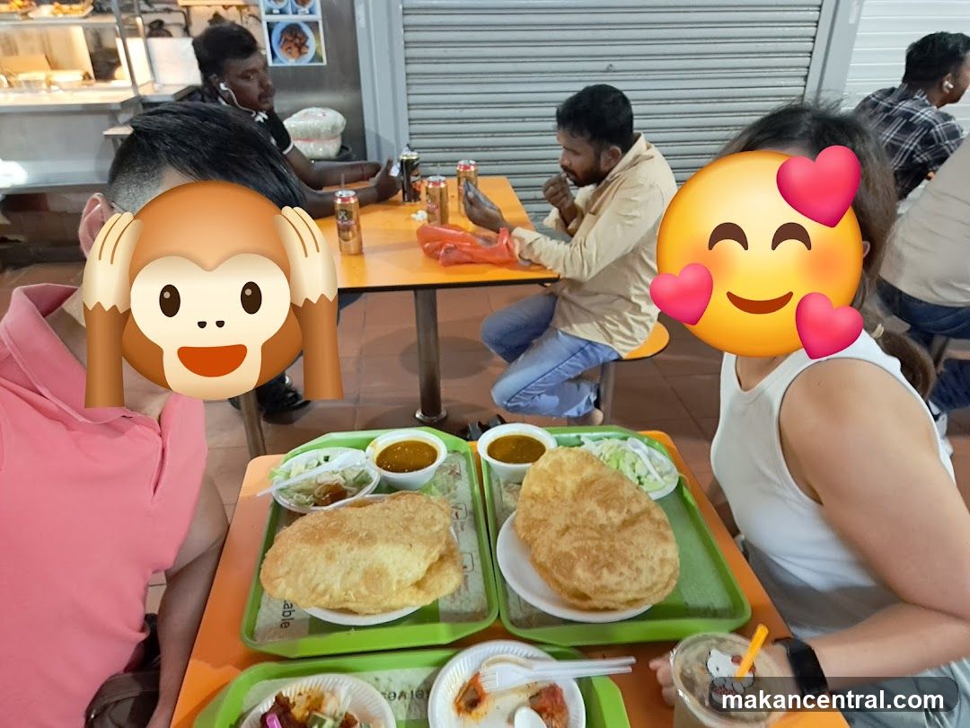 People eating at a food stall