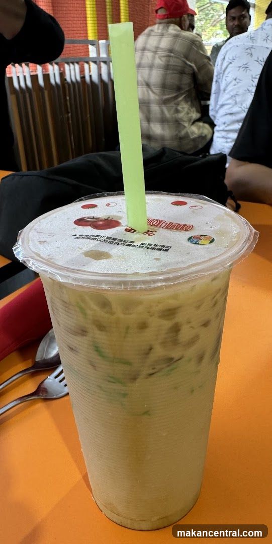 Iced Drink with Green Straw