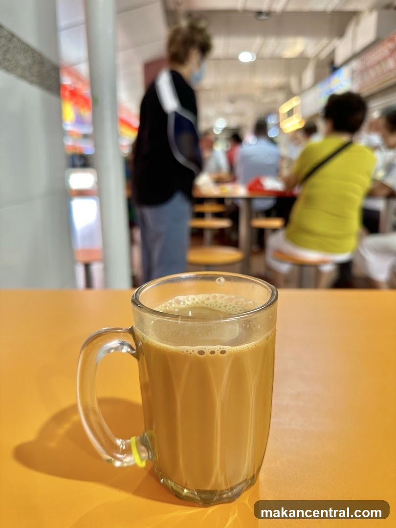 Coffee in a glass mug on an orange table