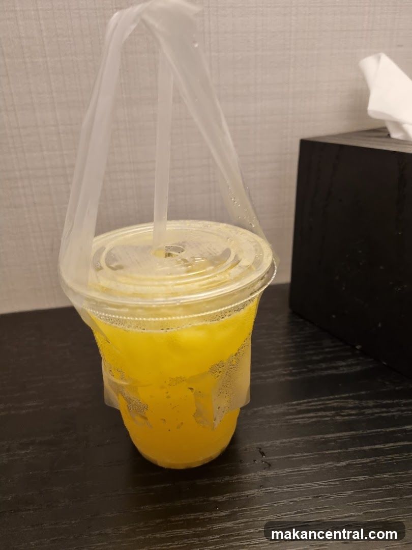 Orange Drink in Plastic Cup
