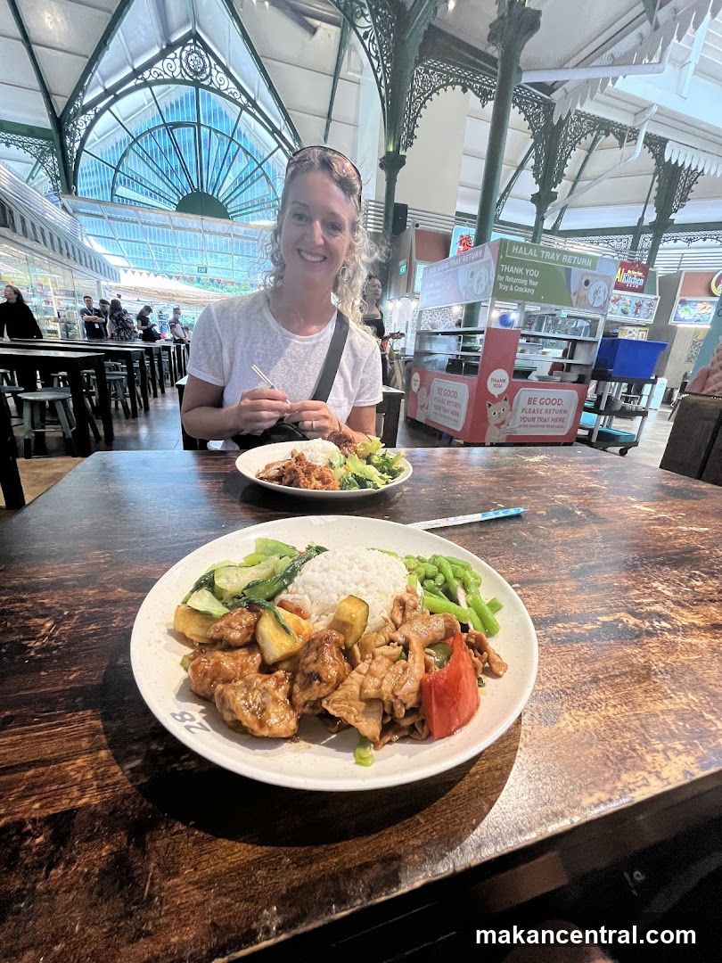 Woman Eating at Food Stall