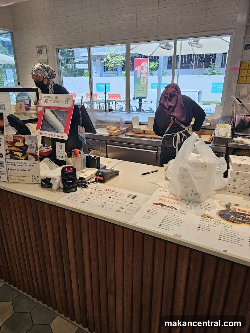Counter with food items and staff