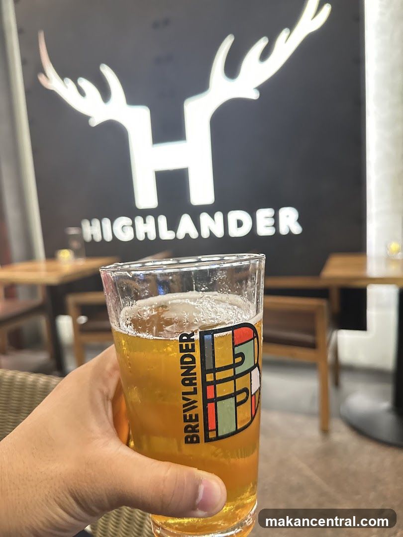 Beer in a glass with Highlander logo
