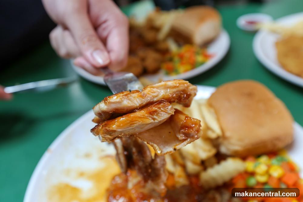 Close-up of grilled chicken on a fork