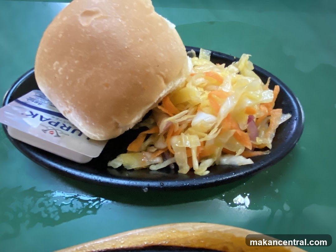 Bread roll with coleslaw and butter