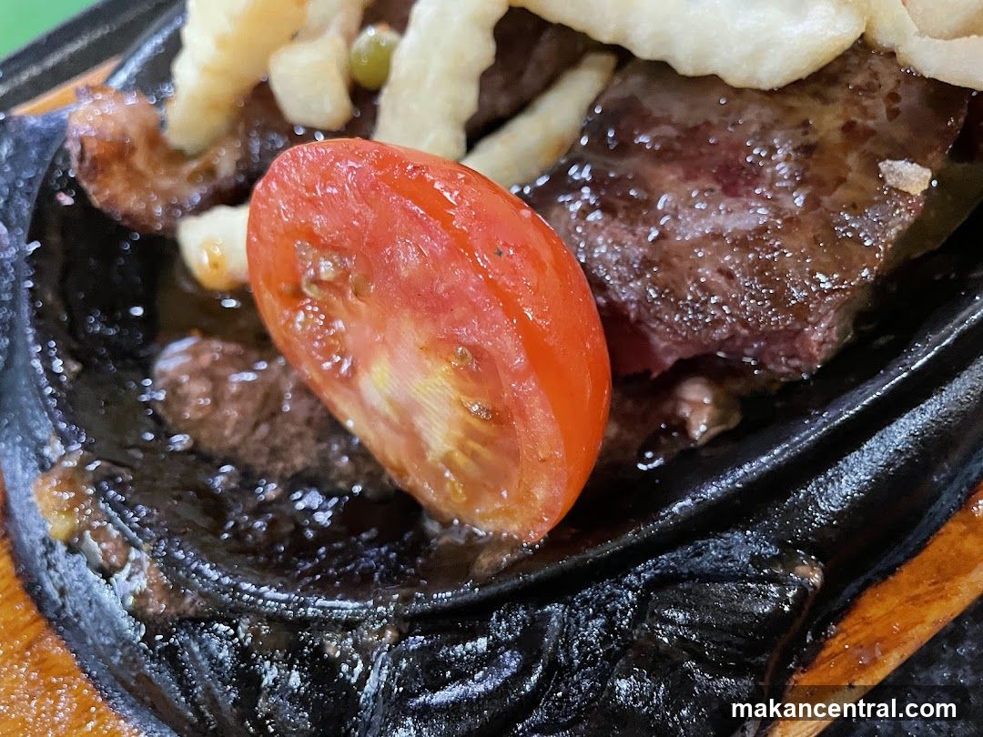 Sizzling Steak with Tomato and Fries