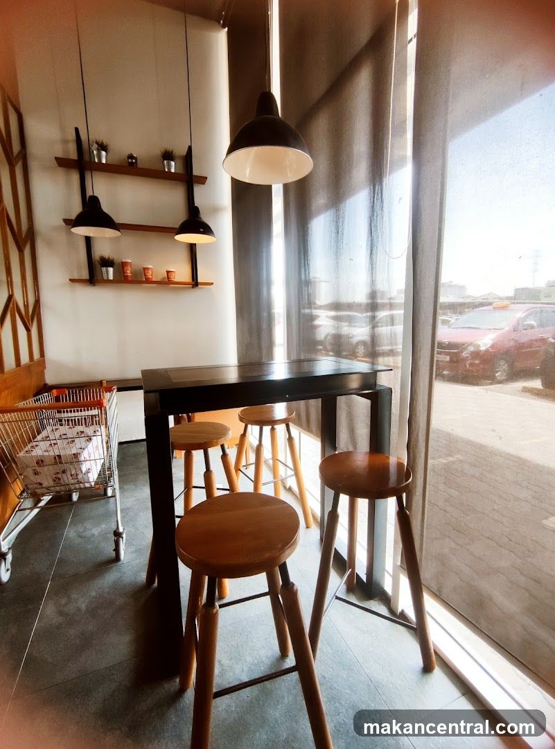 Cafe Interior with High Table and Stools