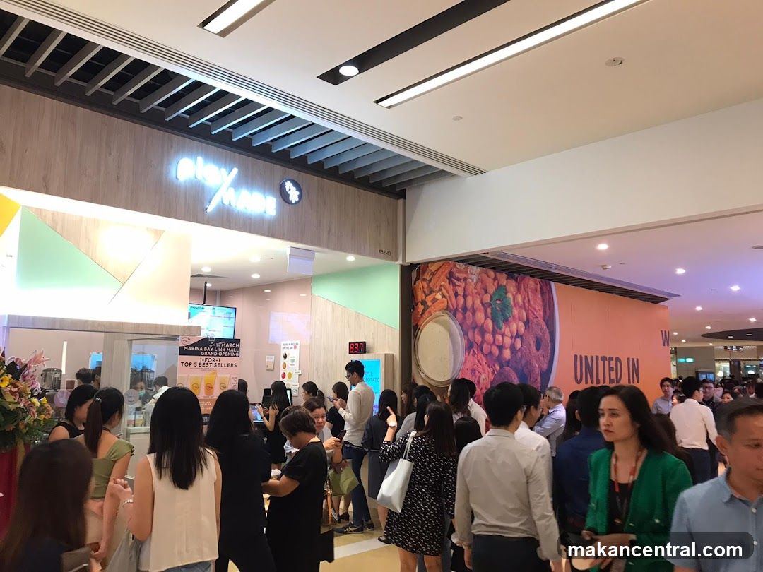 People queuing at a food stall
