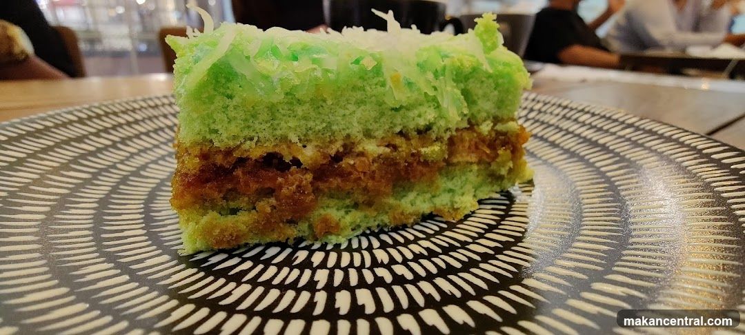 Slice of Green Cake with Coconut Topping